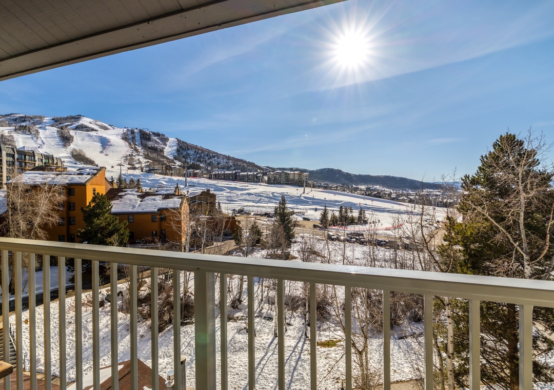 Step onto your private balcony and breathe in crisp mountain air while soaking up stunning ski slope views.