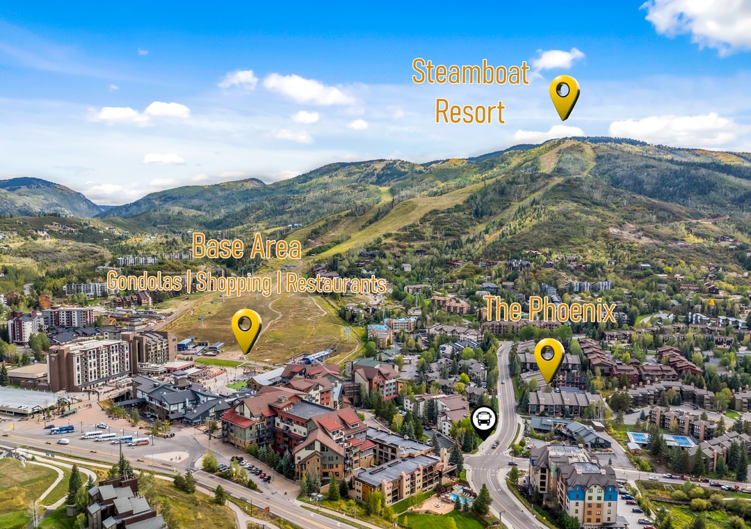 An aerial view of Steamboat Springs shows the resort nestled in the mountains, with the base area's condos, dining, and shops below, and the Phoenix neighborhood in the foreground.