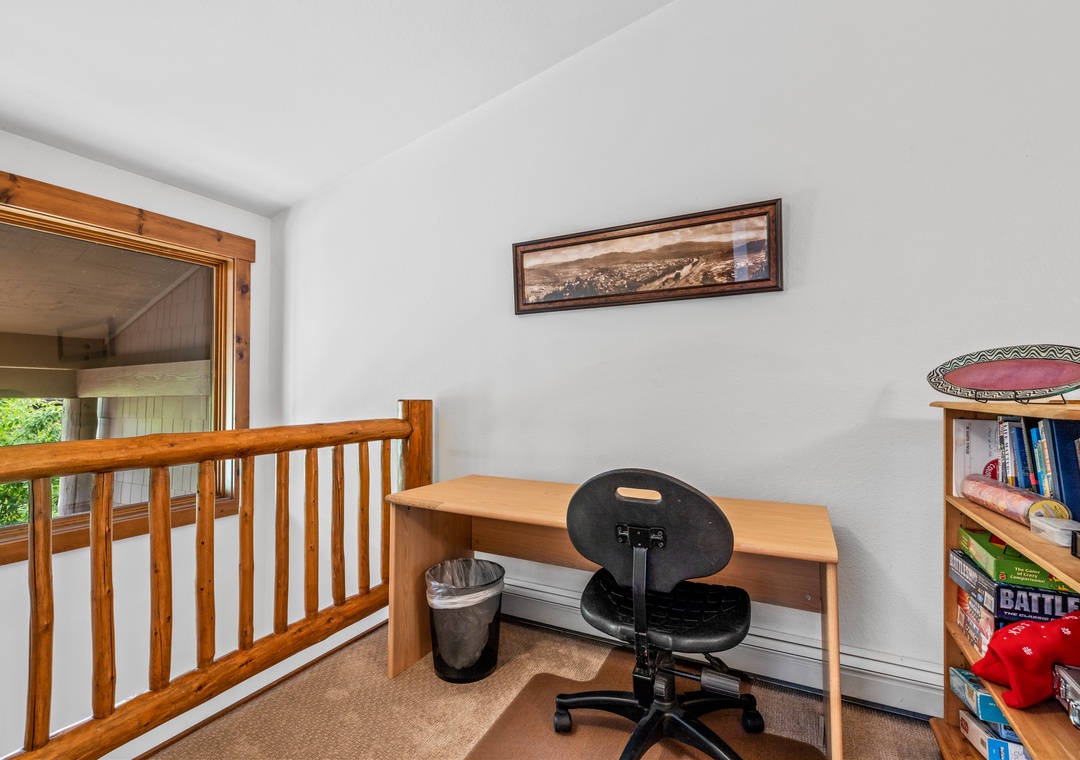 Your own quiet corner awaits, with a simple desk and chair perfect for catching up on emails or planning your next adventure.