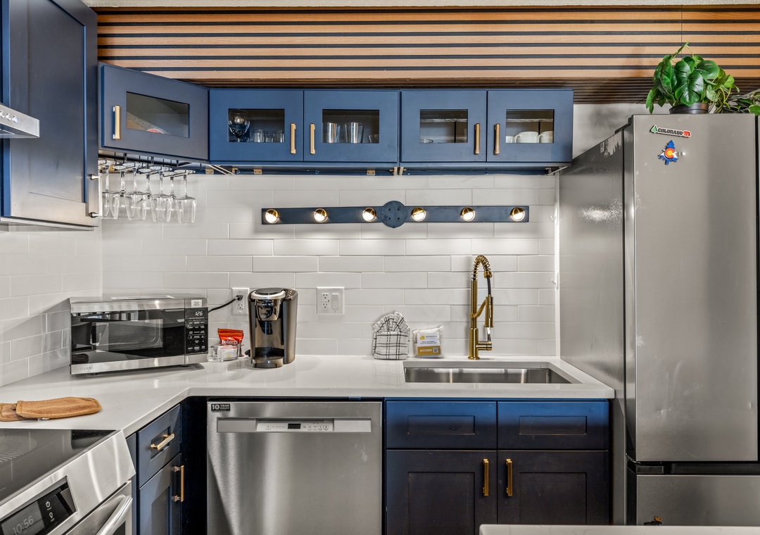 Your stylish blue kitchen features all premium appliances you need for memorable meals together.