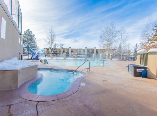 Soak away winter's chill in this inviting outdoor hot tub, surrounded by crisp mountain air and snow-dusted trees. Your perfect après moment awaits.