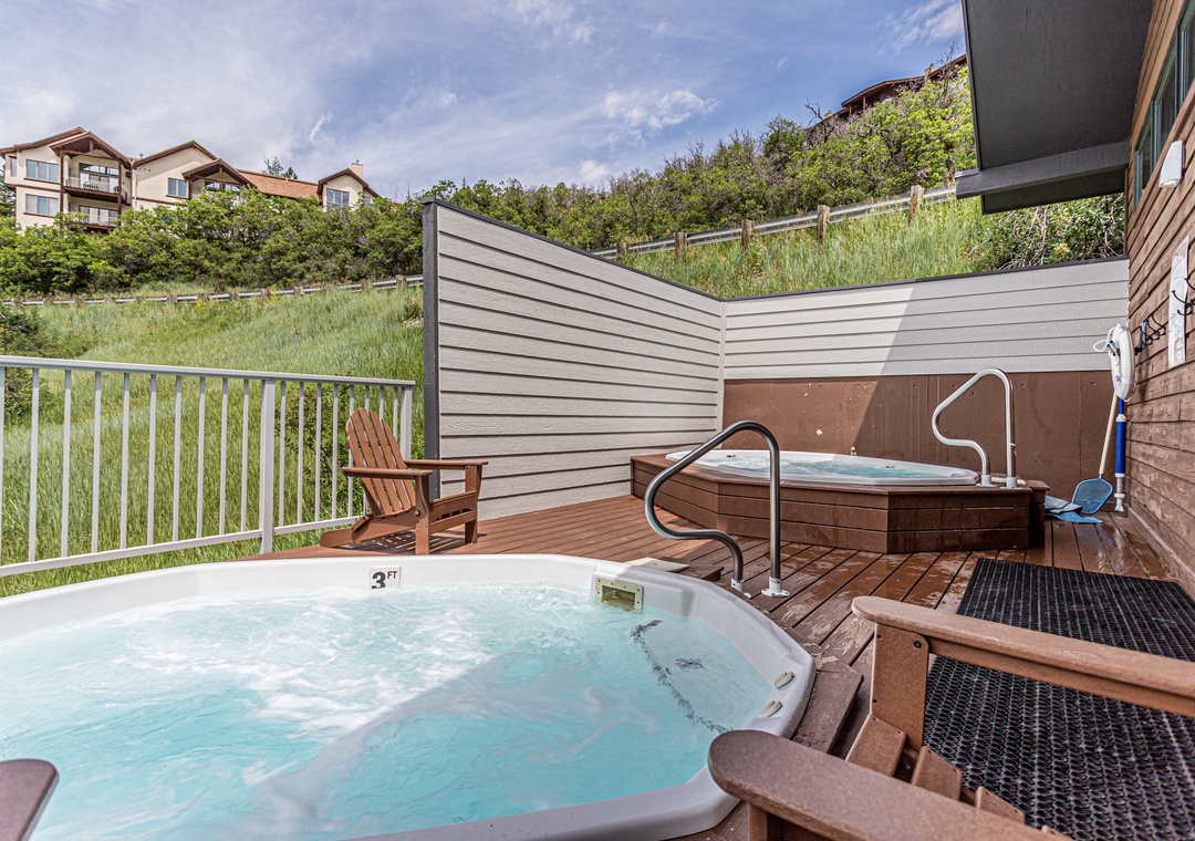 Soak your stress away in the community hot tub oasis, surrounded by peaceful mountain views and warm wood decking.