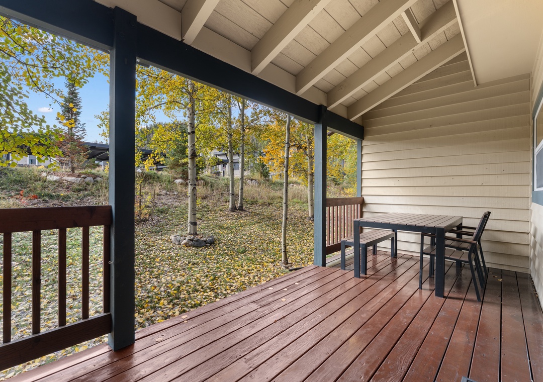 Your private covered deck overlooks a serene grove of aspens, where golden autumn leaves create a peaceful retreat perfect for morning coffee or evening relaxation.