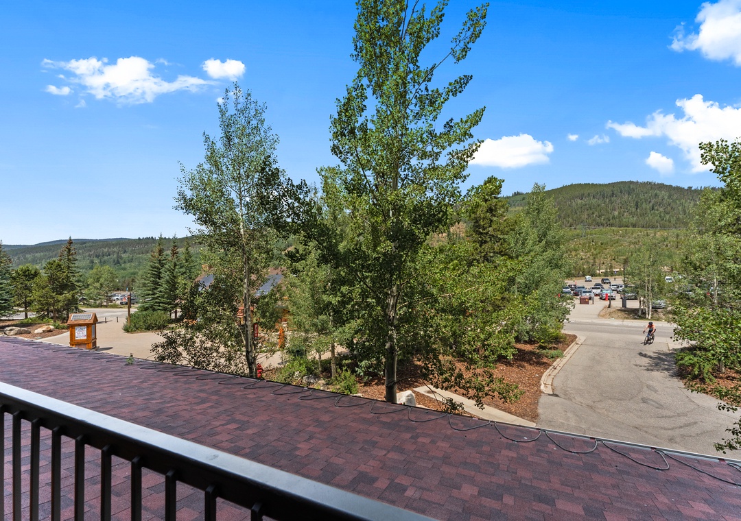 Scenic mountain views frame the peaceful neighborhood below from your private balcony perch.