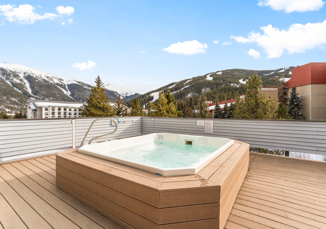 Soak in your private hot tub while taking in breathtaking snow-capped mountain views from this stunning rooftop terrace.