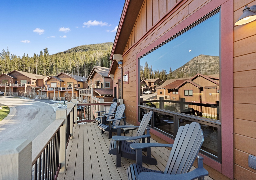 Relax on your private deck with comfortable Adirondack chairs, taking in stunning mountain views and the peaceful residential setting.