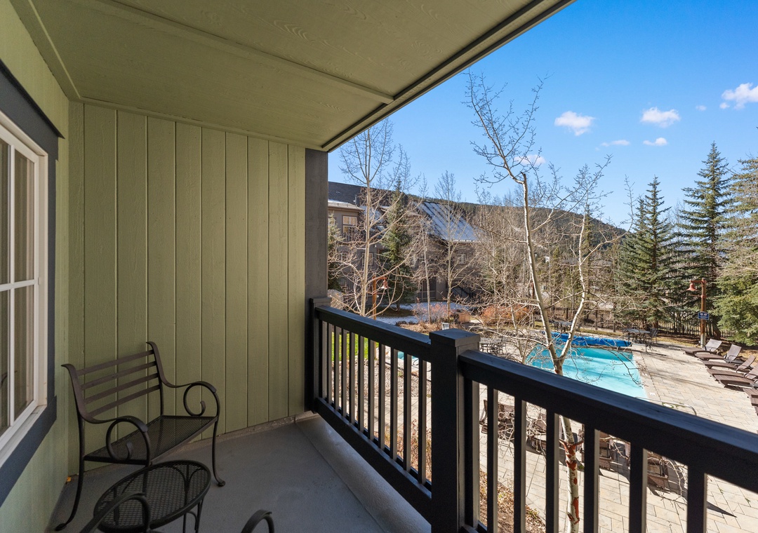 Enjoy stunning mountain vistas and pool views from your private balcony—perfect for morning coffee or evening relaxation.