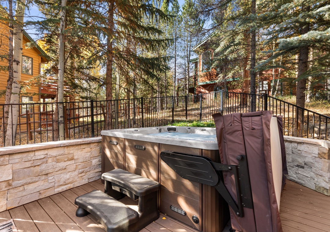 Soak away your cares in your private hot tub, surrounded by towering evergreens and peaceful mountain air—the perfect spot to unwind after a day of adventure.