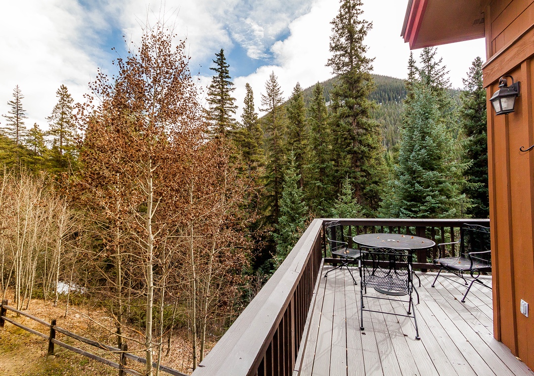 Step onto your private balcony and breathe in the crisp mountain air while autumn colors paint the surrounding forest in golden hues.