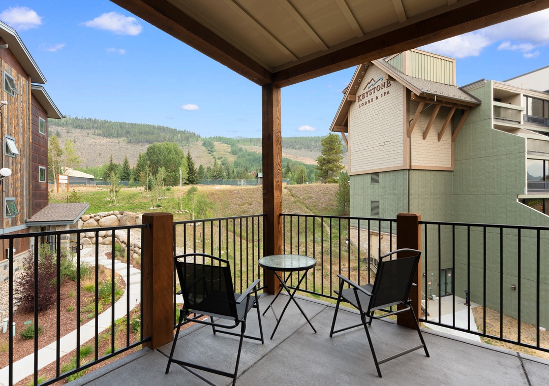 Step out onto your private covered balcony and breathe in the fresh mountain air. Two chairs and a bistro table invite you to sip your morning coffee or unwind at sunset, surrounded by peaceful alpine scenery and quiet neighborhood charm.