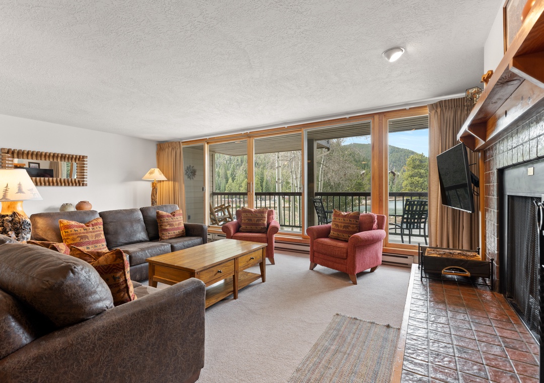 Sink into plush seating by the fireplace while mountain views frame your retreat through floor-to-ceiling windows that open to your private balcony.