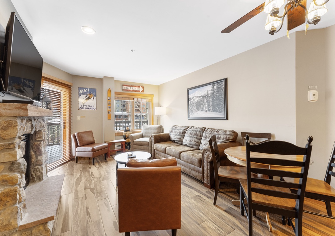 Relax in your mountain-themed living room with stone fireplace, cozy seating, and ski-lodge charm after a day on the slopes.