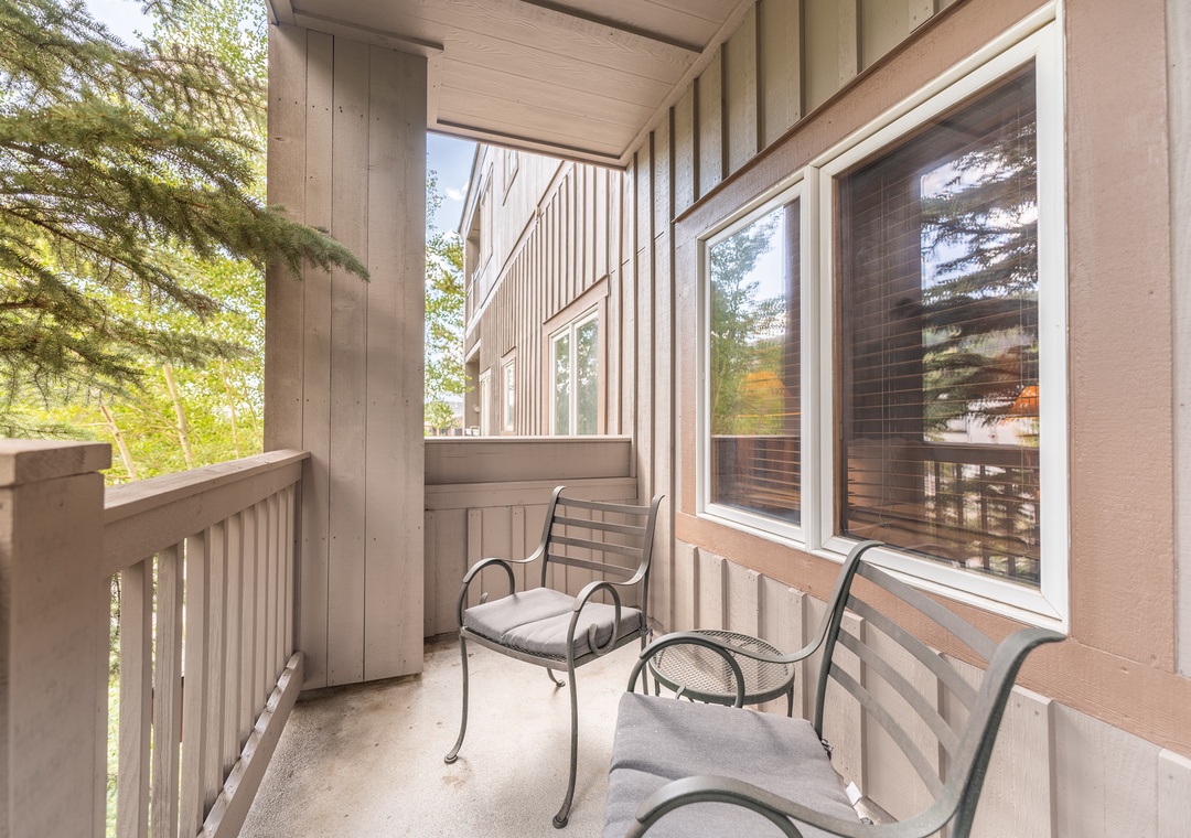 Step onto your private balcony and settle into comfortable seating surrounded by lush forest views.