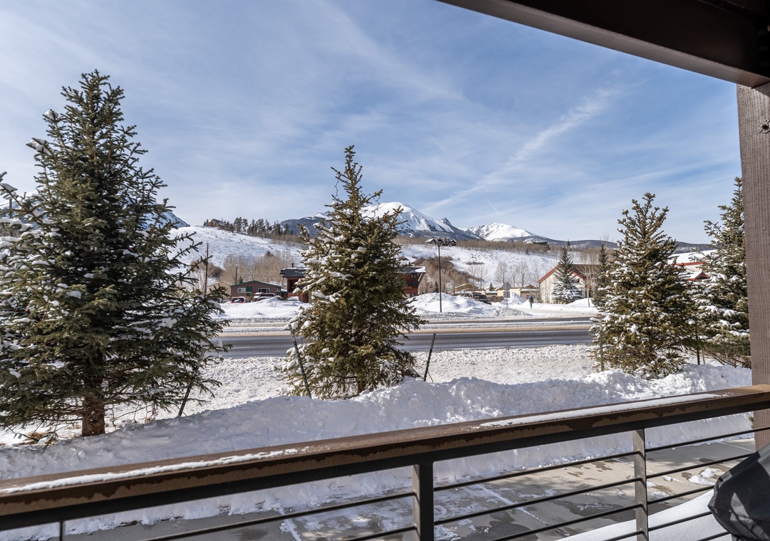 Step onto your private balcony and breathe in the crisp mountain air while snow-capped peaks frame your winter wonderland view.