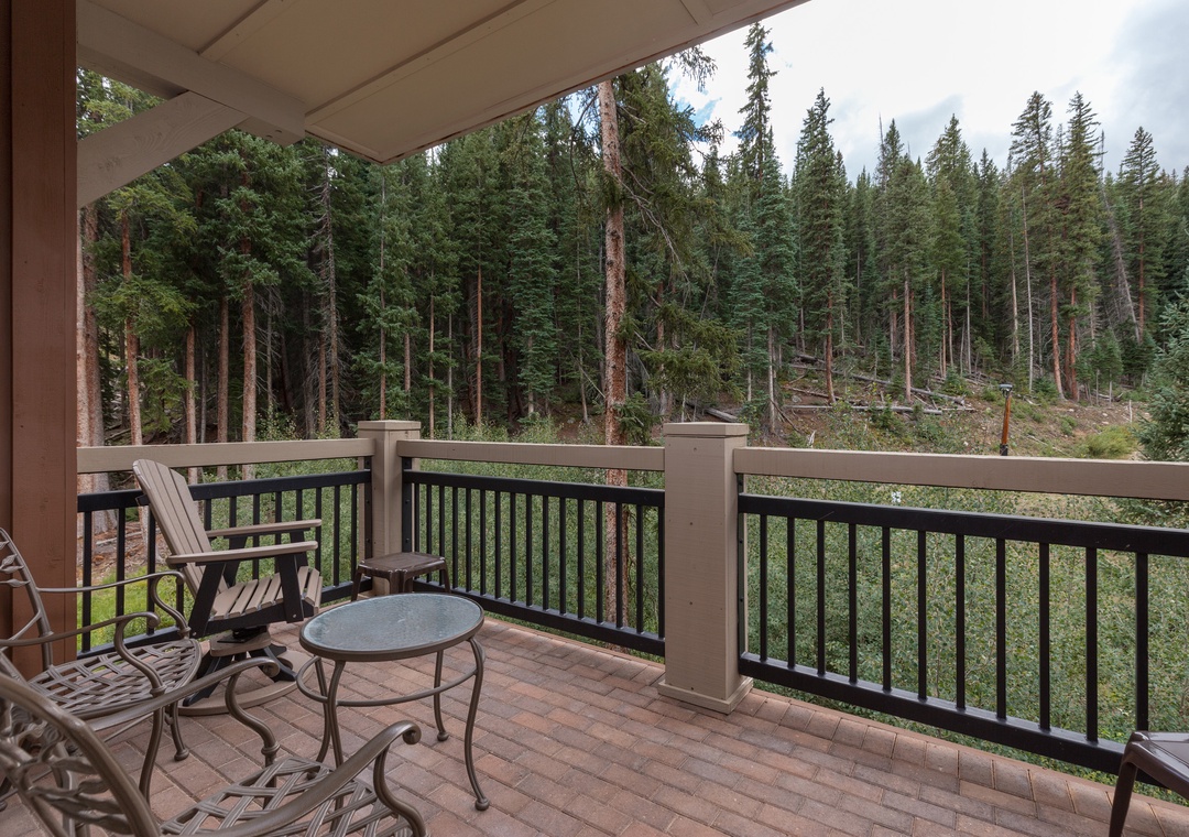 Breathe in the crisp mountain air from your private balcony, where morning coffee feels magical surrounded by towering evergreens.