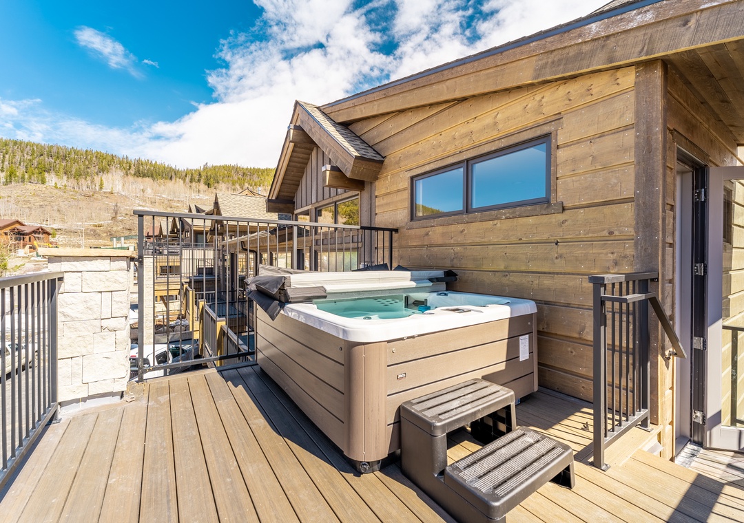 Soak in your private hot tub on this stunning wooden deck, surrounded by mountain views and alpine serenity.
