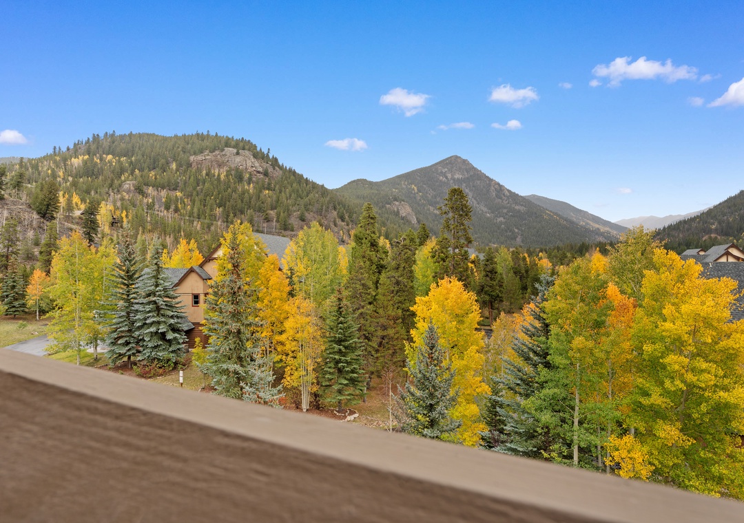 Stunning mountain vistas framed by vibrant golden aspens create a breathtaking autumn backdrop for your stay.