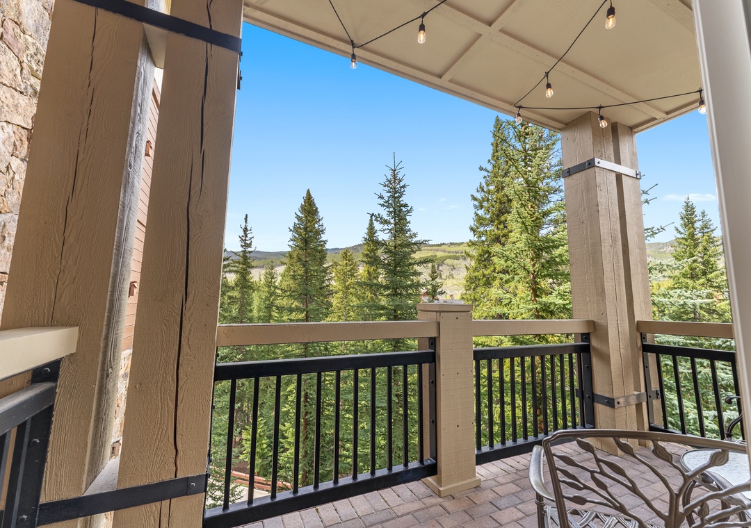 Relax on your private covered terrace while taking in sweeping views of towering evergreen trees and rolling hills.
