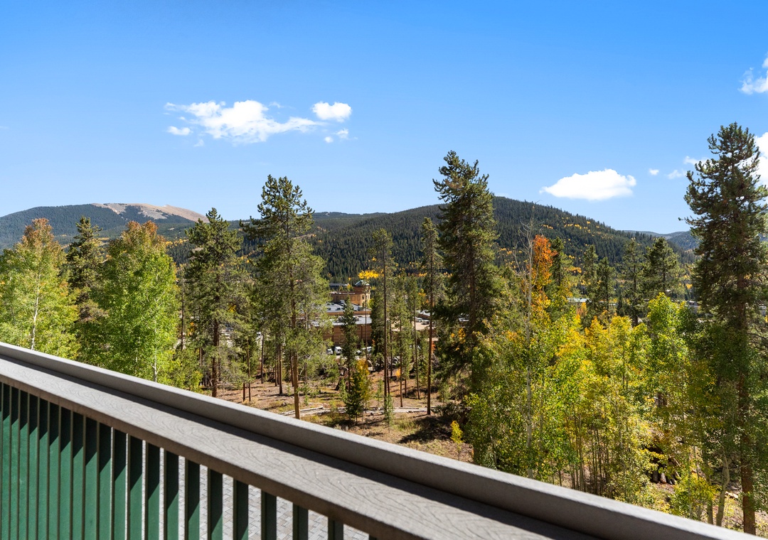 Step onto your private balcony and breathe in the crisp mountain air while taking in sweeping views of forested peaks and autumn colors.