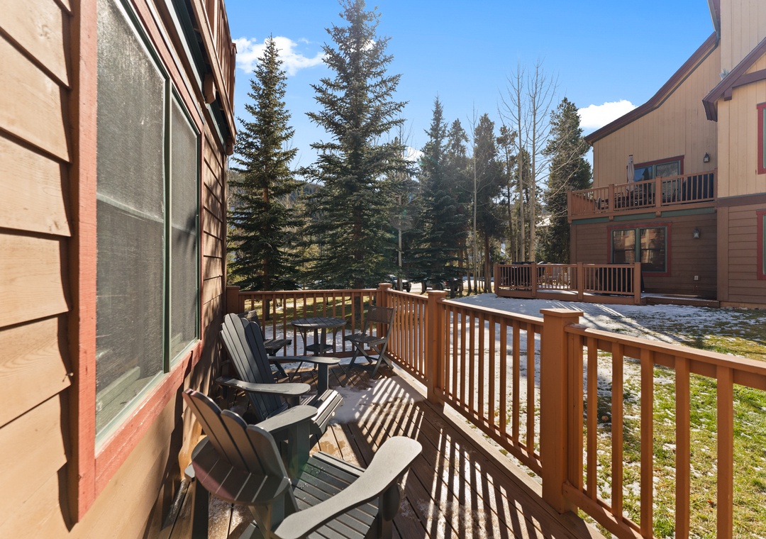 Step onto your private deck where cozy chairs await, framed by towering evergreens and crisp mountain air.