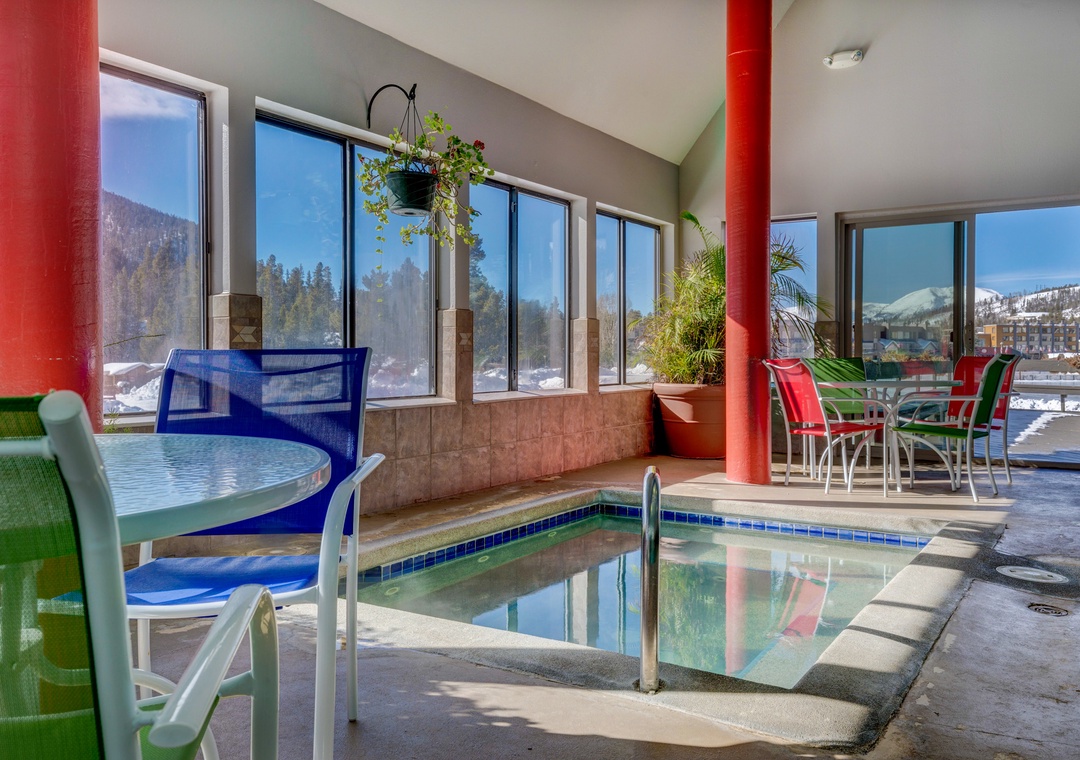 You'll love unwinding in this bright indoor pool area with mountain views and relaxing hot tub after your adventures.