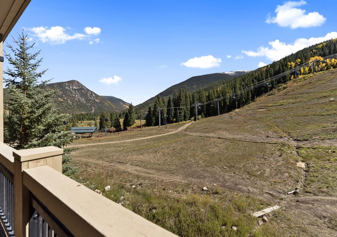 Mountain valley vista from your private balcony with ski slopes and fall foliage in view.