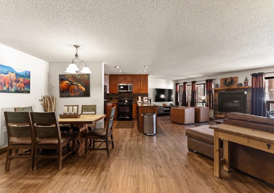 Your spacious open-concept suite blends rustic charm with modern comfort, featuring a cozy fireplace and mountain-inspired décor for perfect relaxation.