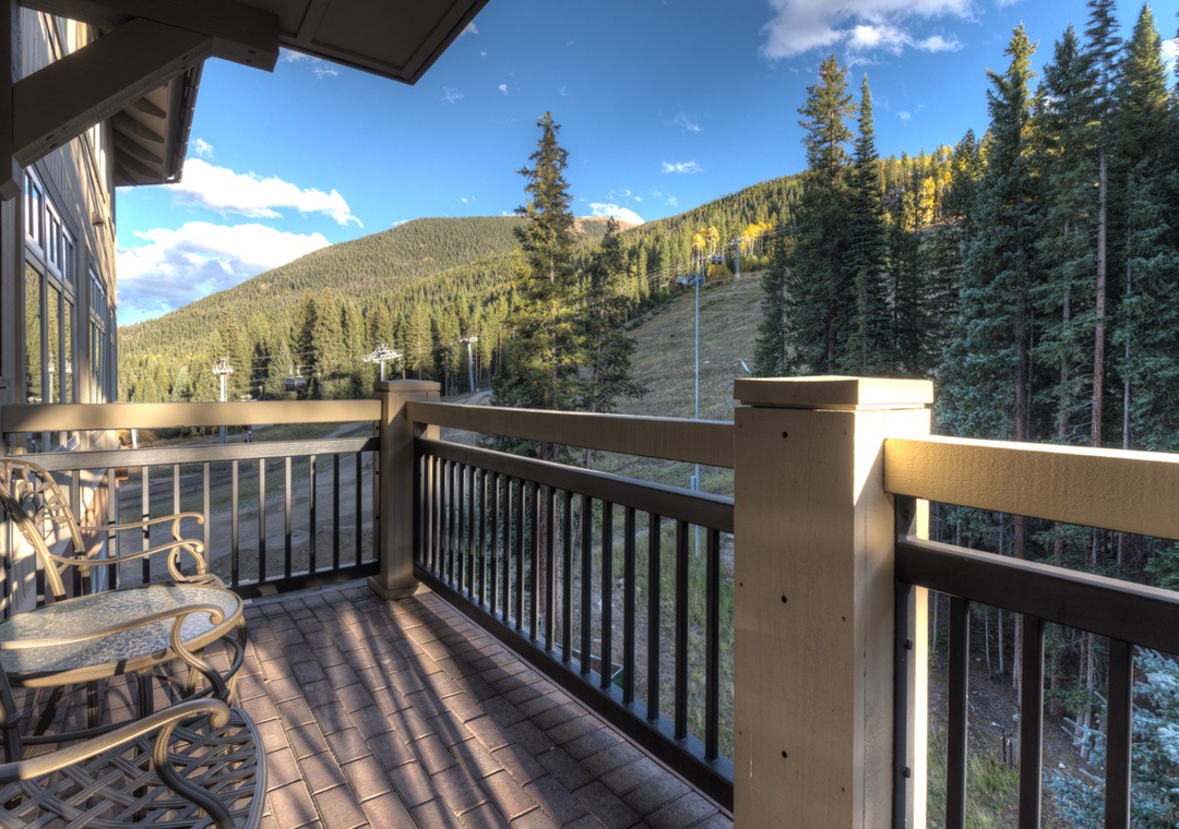 Step onto your private balcony and breathe in the crisp mountain air while taking in sweeping forest views that stretch endlessly before you.