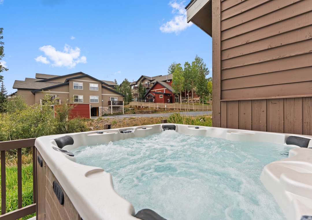 Soak your cares away in the private hot tub, where bubbling jets and peaceful mountain neighborhood views create your perfect escape after a day of adventure.