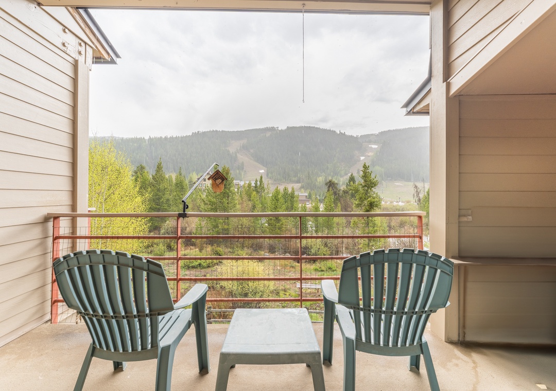 Step onto your private balcony and soak in breathtaking mountain views while enjoying your morning coffee in comfortable outdoor seating.