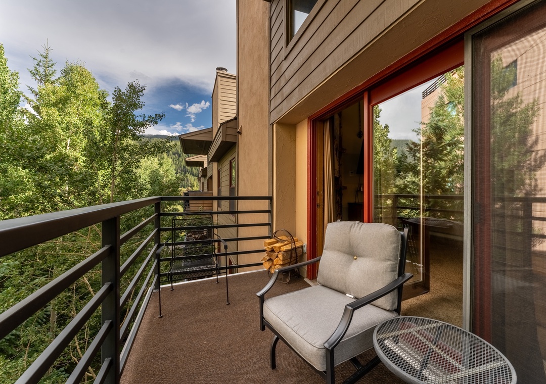 Relax in your private chair with forest views, where sliding glass doors lead you inside.