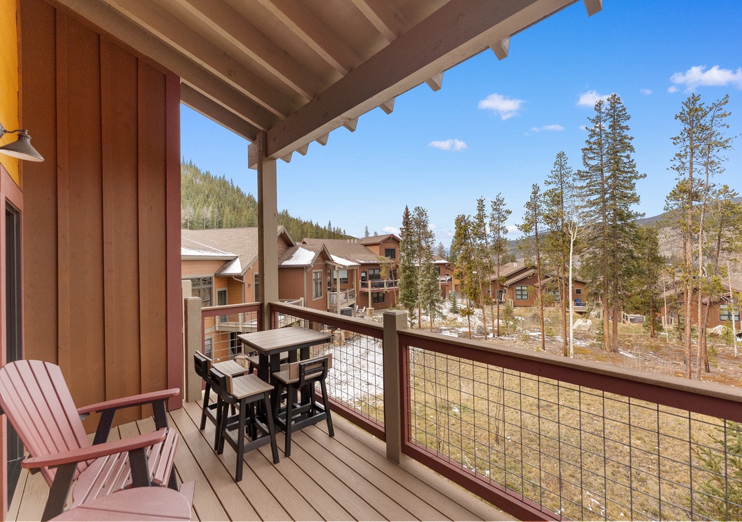 Step onto your private balcony and breathe in the crisp mountain air while enjoying panoramic views of the forest and surrounding homes.