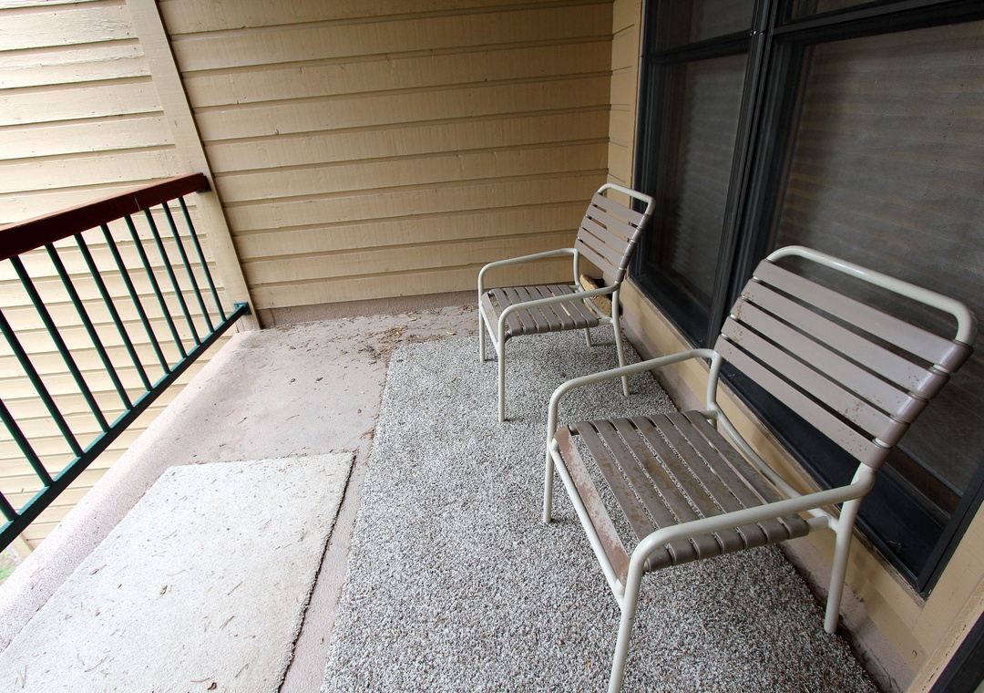 Your private balcony awaits with comfortable seating where you can sip morning coffee or unwind after exploring the area.