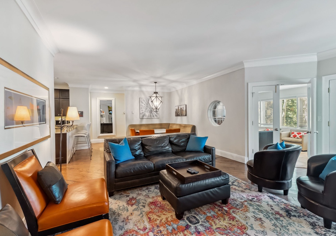 Sink into plush leather seating while city views frame your stylish retreat through oversized windows.