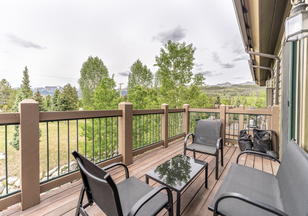 Step onto your private deck and breathe in the fresh mountain air while taking in stunning forest and peak views from your comfortable outdoor seating.
