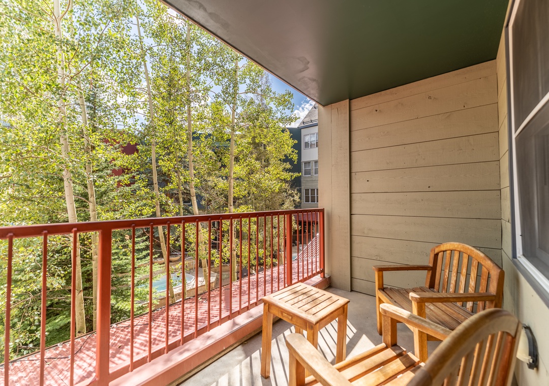 Sip your morning coffee on your private balcony, surrounded by lush treetops and peaceful forest views.