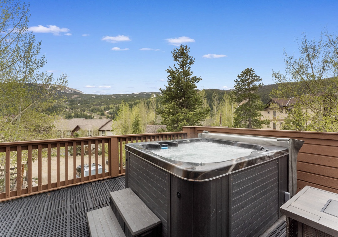 Soak in your private hot tub while gazing at stunning mountain vistas and forest canopy stretching endlessly before you.