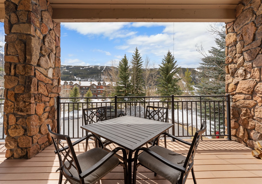 Step onto your private balcony where mountain views and stone columns create your perfect morning coffee retreat.