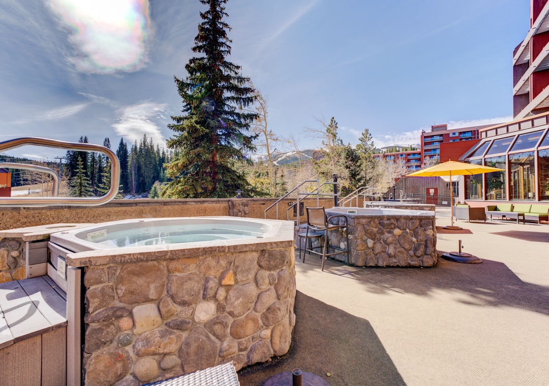 Soak in mountain-view hot tubs surrounded by evergreen trees and crisp alpine air on this stunning outdoor terrace.