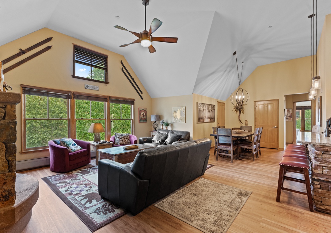 Step into your open-concept retreat where vaulted ceilings and warm wood floors create an inviting space for memorable gatherings.