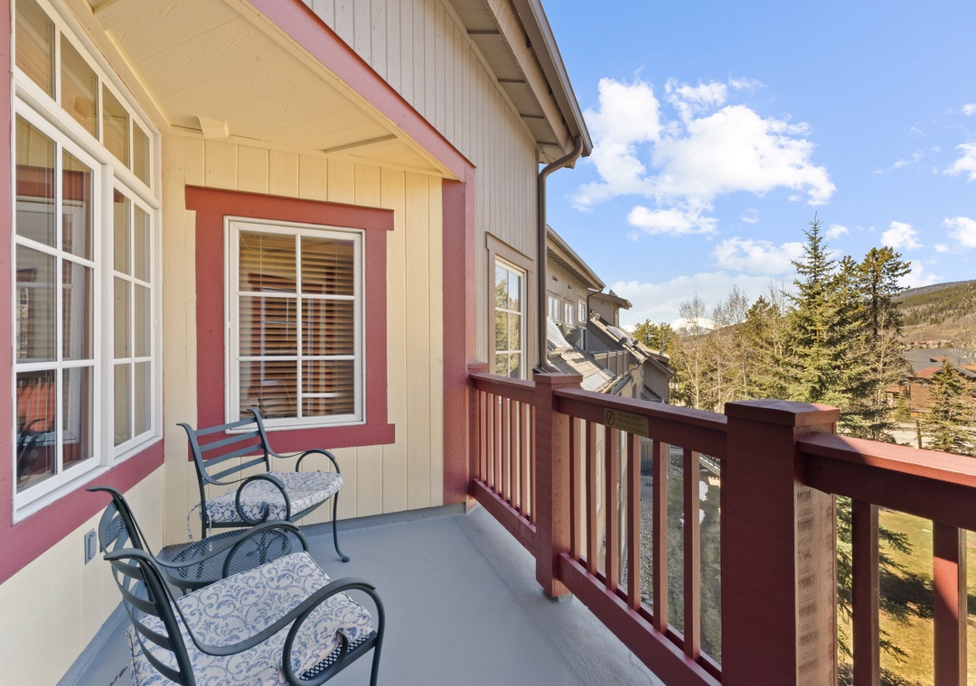 Relax on your private balcony with mountain views, comfortable seating, and fresh alpine air surrounding this charming retreat.