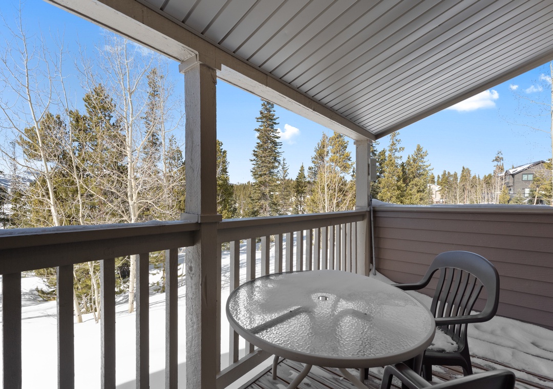 Step out onto your private balcony and breathe in the crisp mountain air while taking in stunning winter forest views.