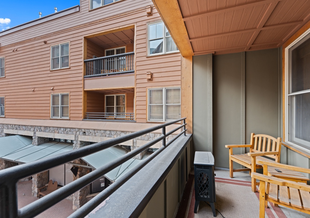 Your private balcony offers a peaceful retreat with comfortable seating, perfect for morning coffee or unwinding after a day of mountain adventures.