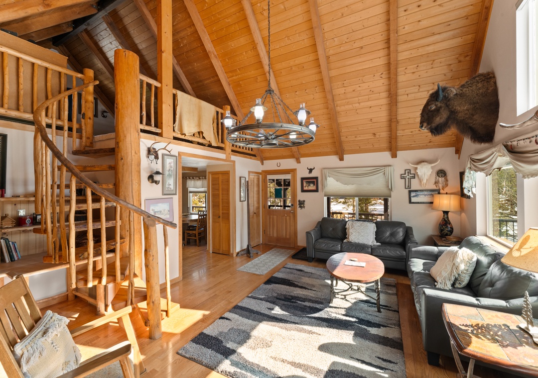 Step into your cozy cabin retreat with soaring wood-beamed ceilings and rustic charm that makes you feel right at home.