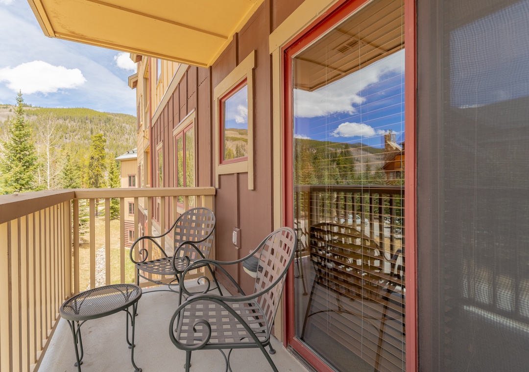 Step onto your private balcony and breathe in the mountain air while enjoying stunning alpine views from your cozy seating area.