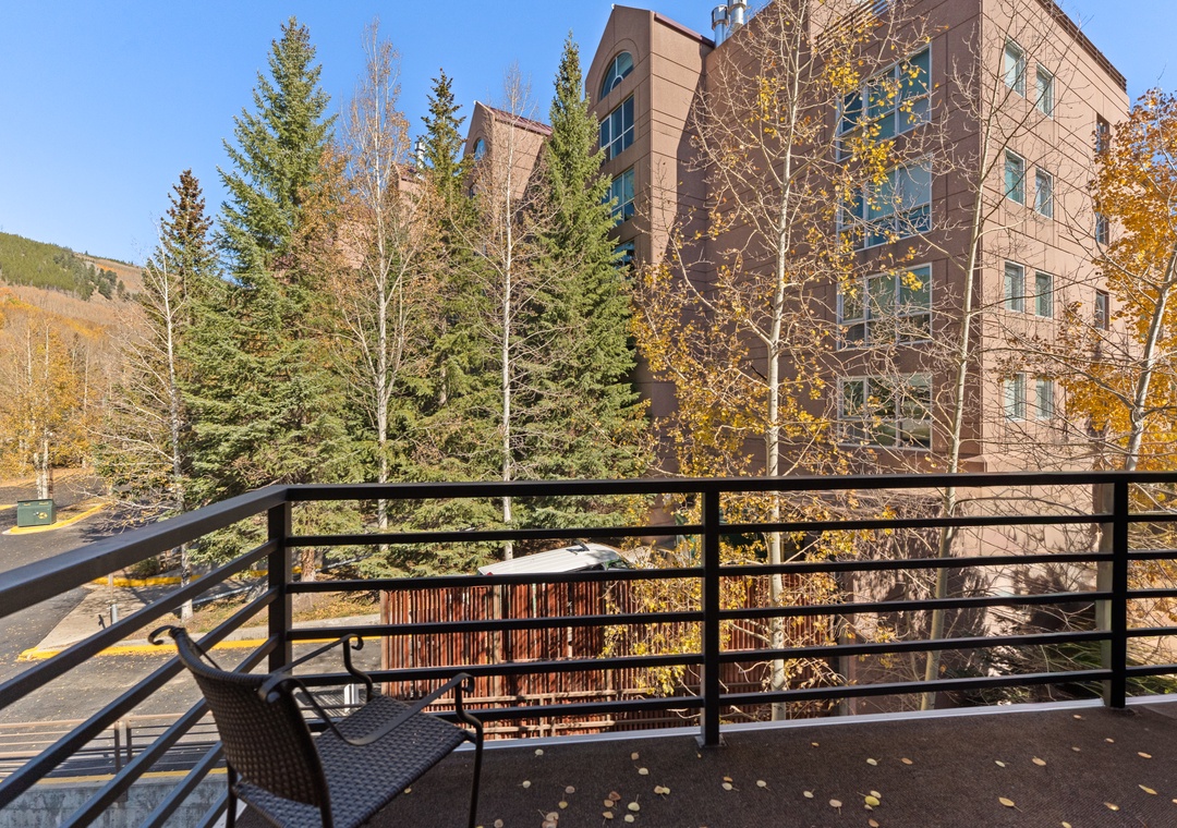 Step onto your private balcony and breathe in crisp mountain air while golden autumn leaves dance around you.