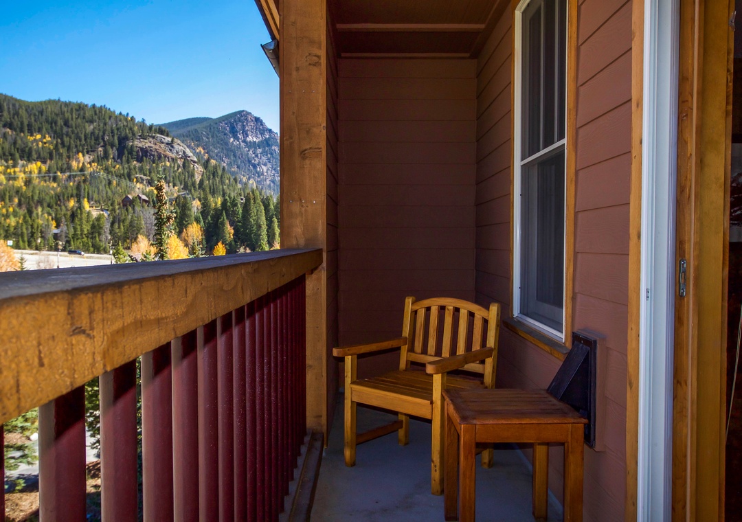 Your private balcony offers peaceful mountain views and a cozy spot to enjoy morning coffee surrounded by autumn colors.