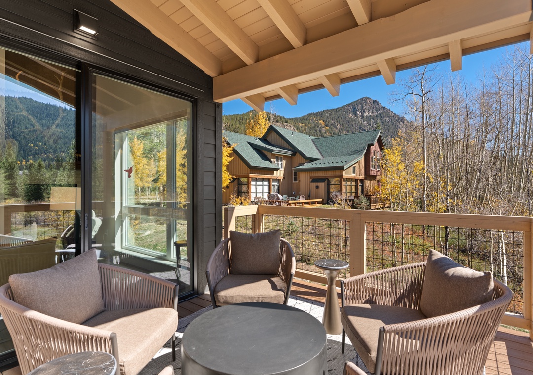 Settle into your private balcony seating and take in the stunning mountain views framed by golden aspens—perfect for morning coffee or evening relaxation.