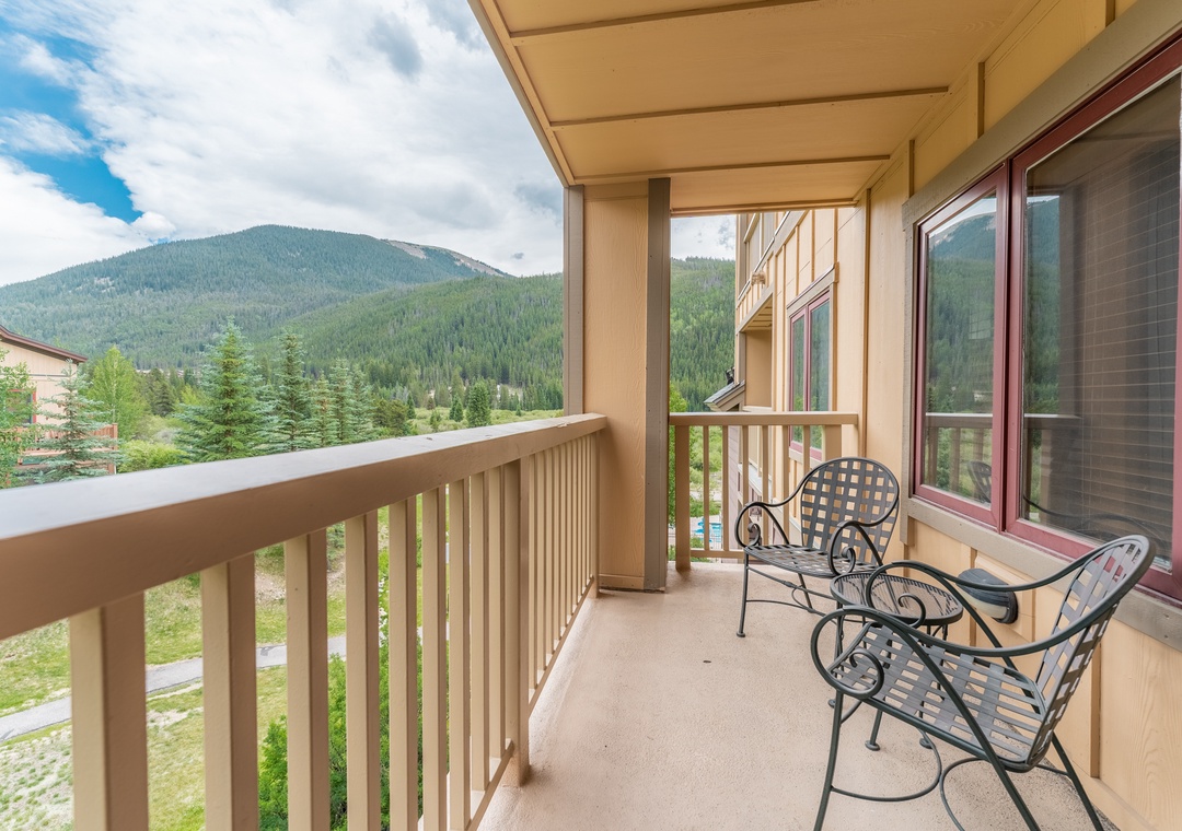 Relax on your private balcony with comfortable seating while taking in breathtaking mountain vistas.