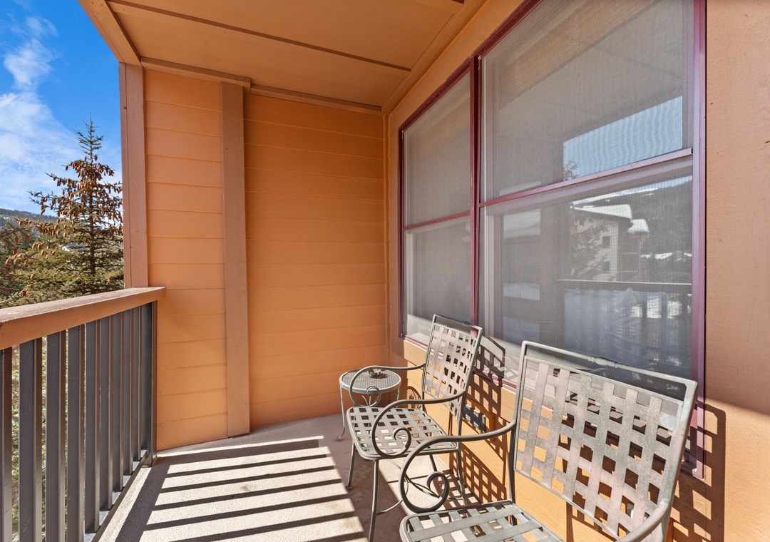 Step onto your private covered balcony with outdoor seating, where mountain air and peaceful views await your morning coffee or evening unwind.
